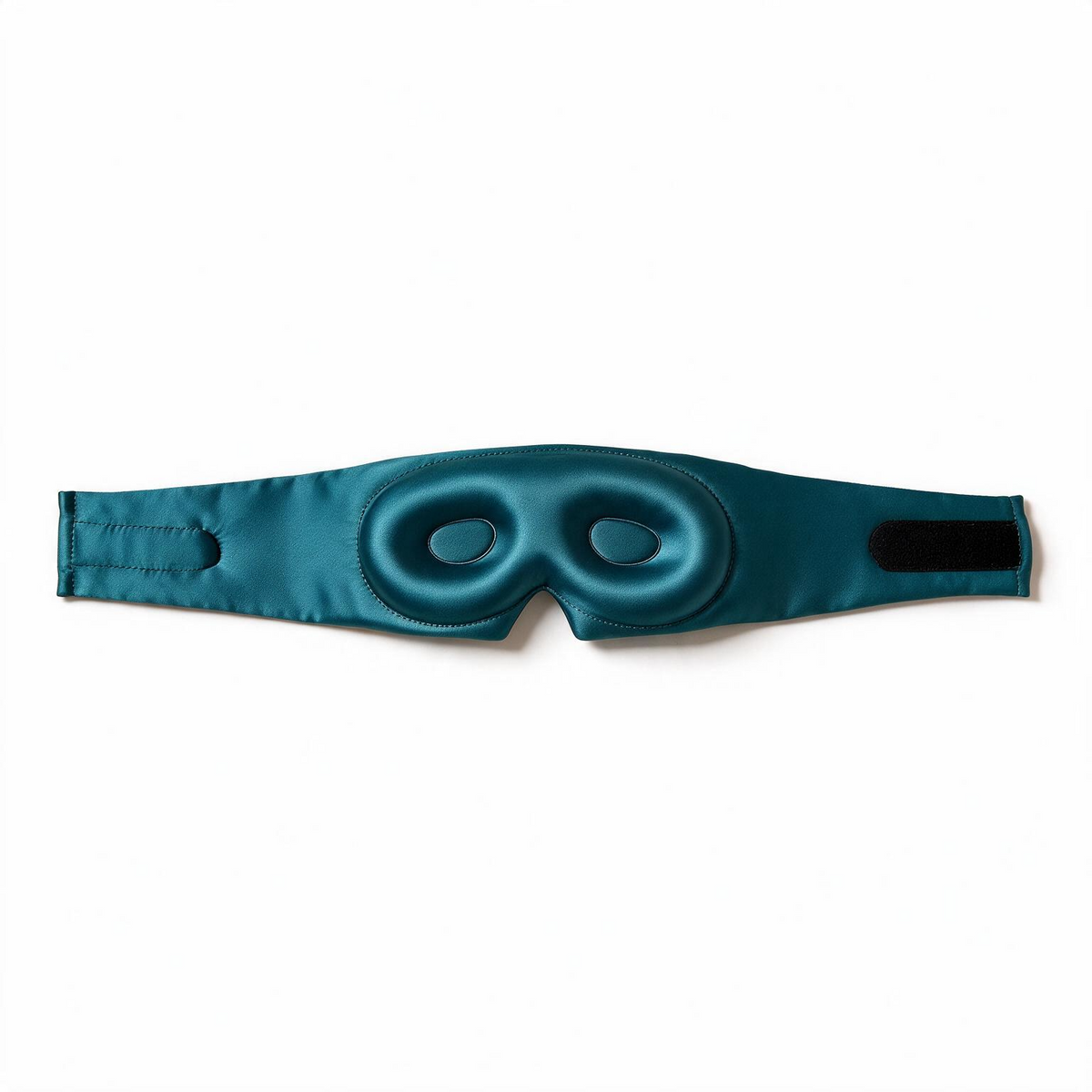 Lunia Reve mulberry silk sleep mask in Fathom on a white background, holding its structured 3D shape