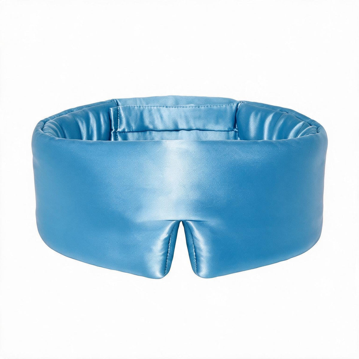 Lunia Reve mulberry silk sleep mask in Sky Blue on a white background, holding its structured 3D shape